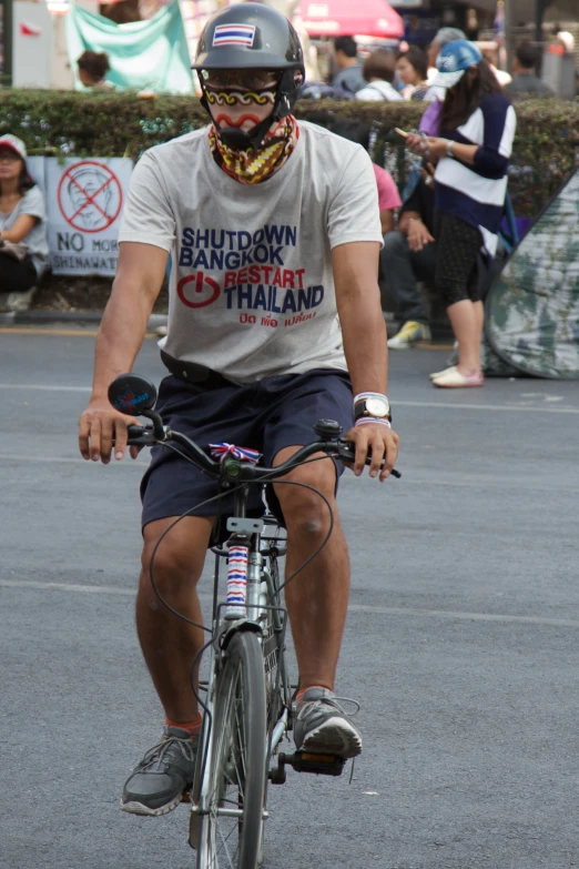 a man riding on the back of a bicycle