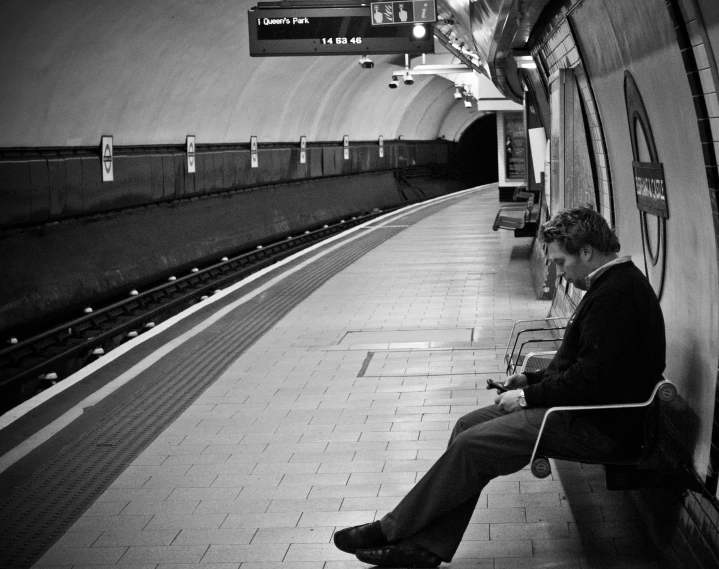 the woman is waiting for her train to stop