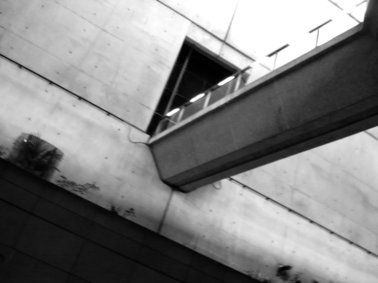 a large cement wall with a window on it