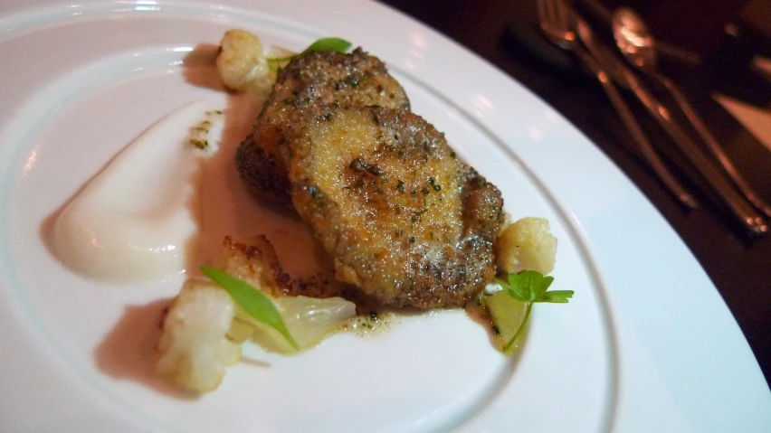 a plate of food that looks like a steak