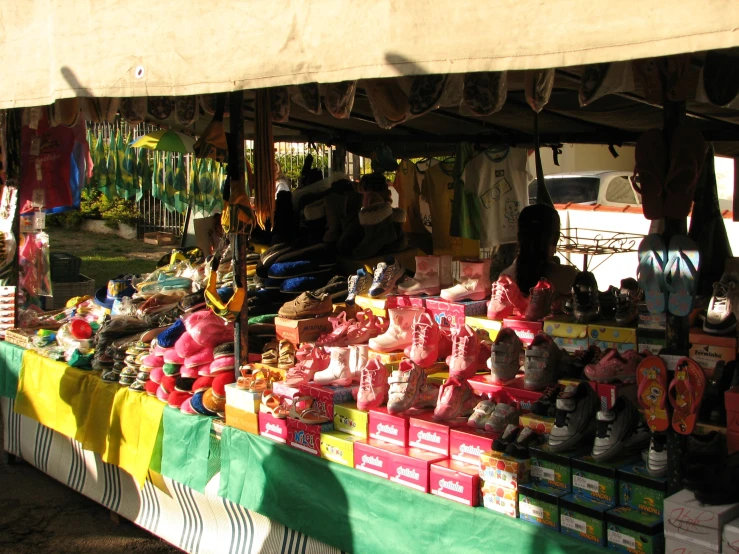 a vendor selling all kinds of stuff toy at a fair