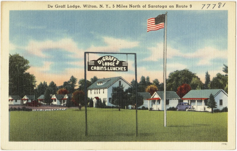 the old postcard has a flag at half mast on the pole