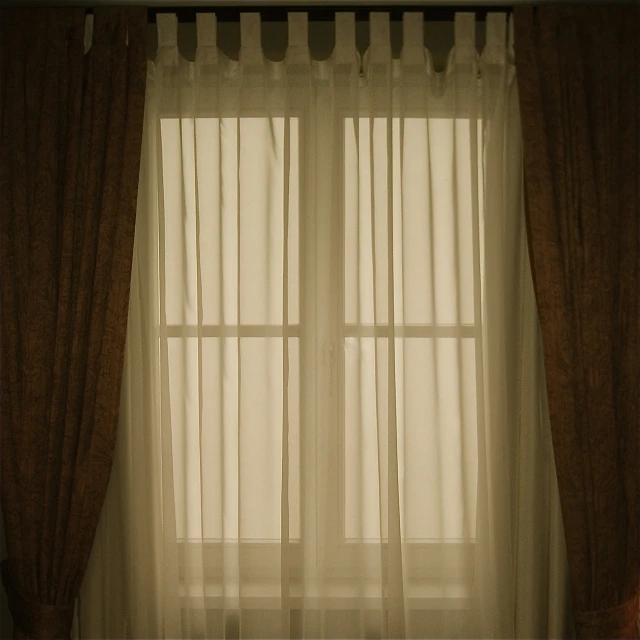 curtains and curtains in front of a window