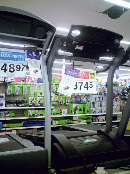 several tread machines sitting in a display in a store