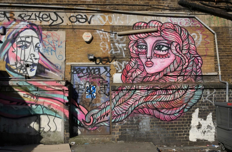 the pink haired woman is painted on the side of the building