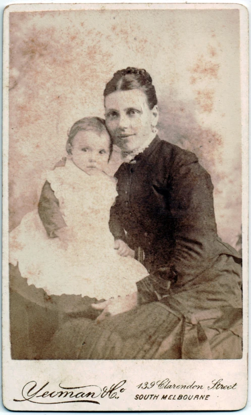 an old po of a woman with a baby