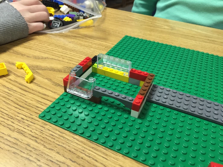an image of a table with legos being constructed
