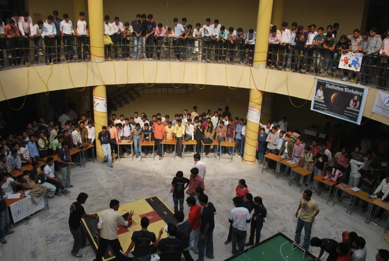 an overhead view of several people standing inside a building