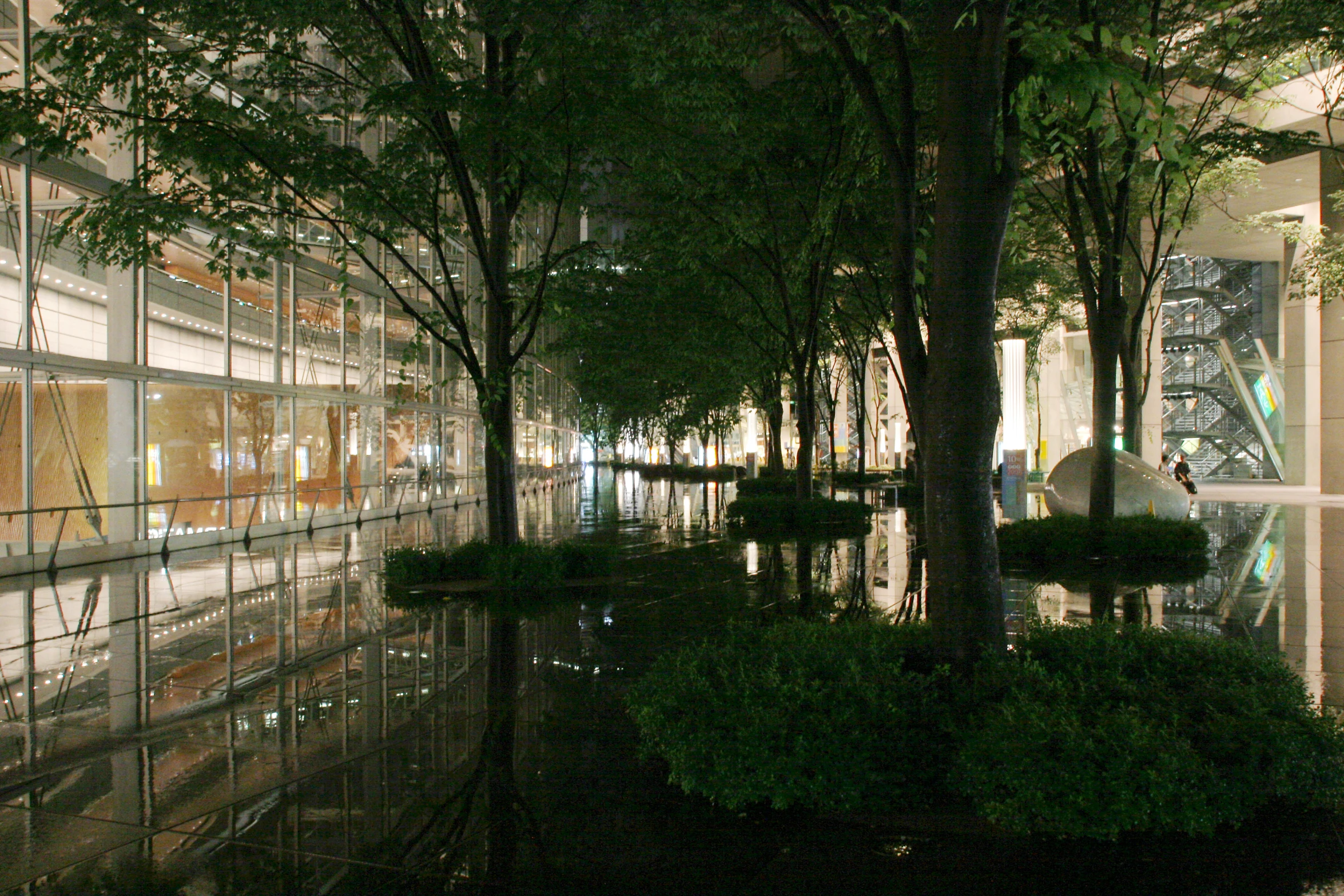 a building that has some plants and trees in it