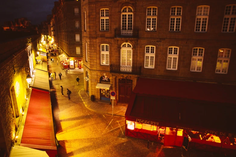 night time scene of the outdoor market on a town street