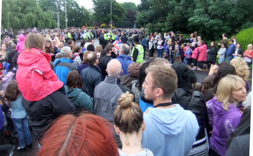 a large group of people standing around each other