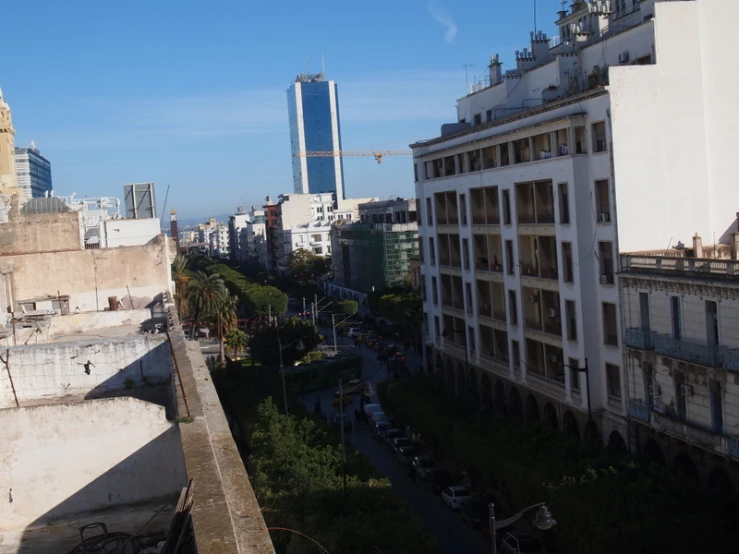 the skyline of city with cars driving on the street