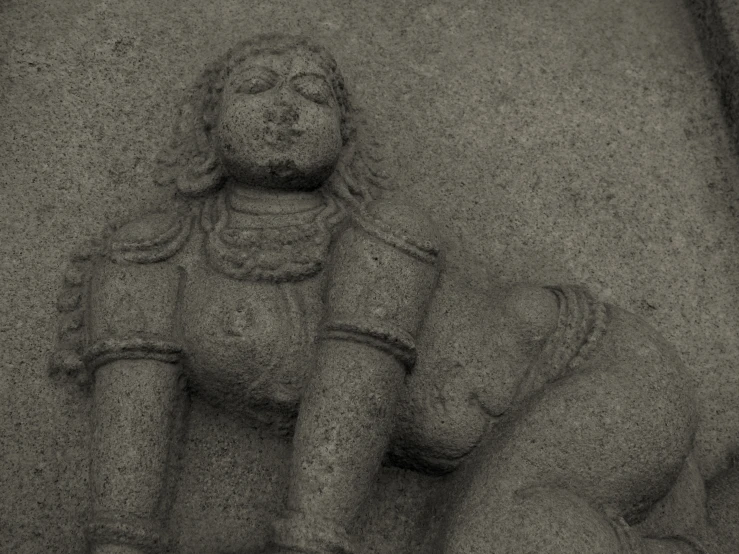 sand art in the shape of a seated man