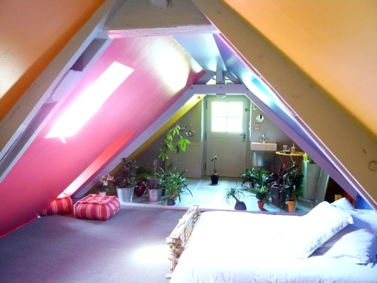 a room that has a bed and pillows in it