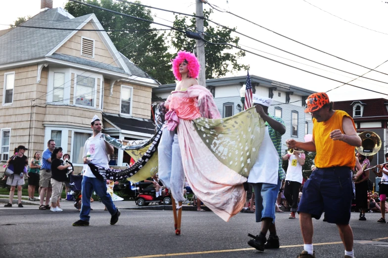 two women and a man with costume dancing