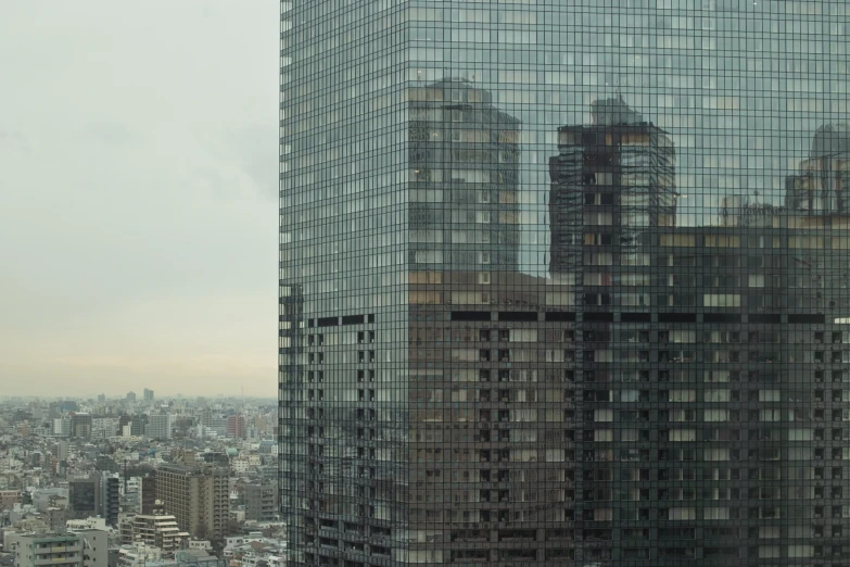 view from an oriental building in the city looking at a very large building