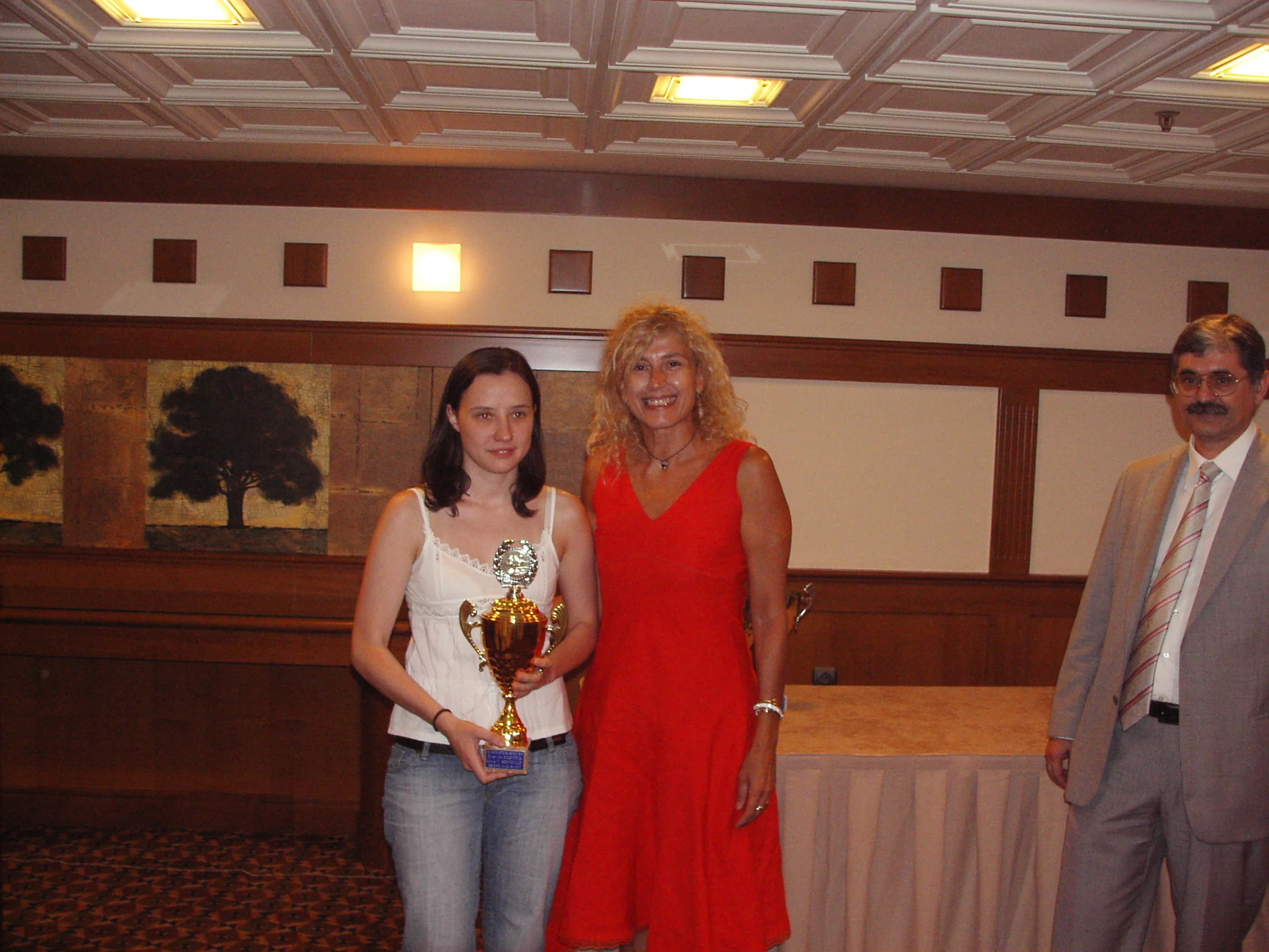 a man and woman with their awards at an event