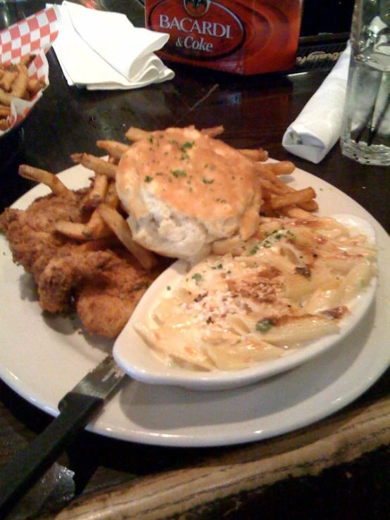 a white plate topped with a hamburger and fries