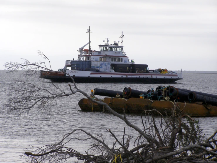 two large boats passing by each other in the water