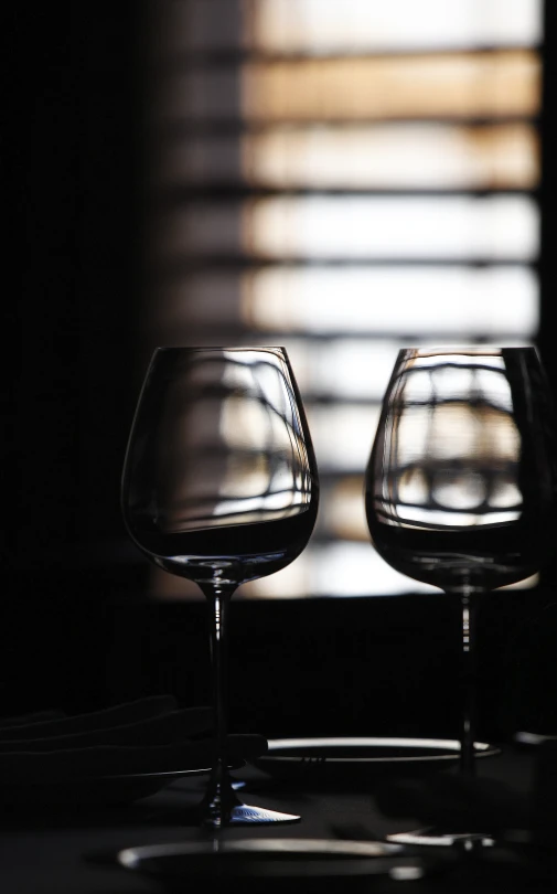 a couple of glasses that are on a table