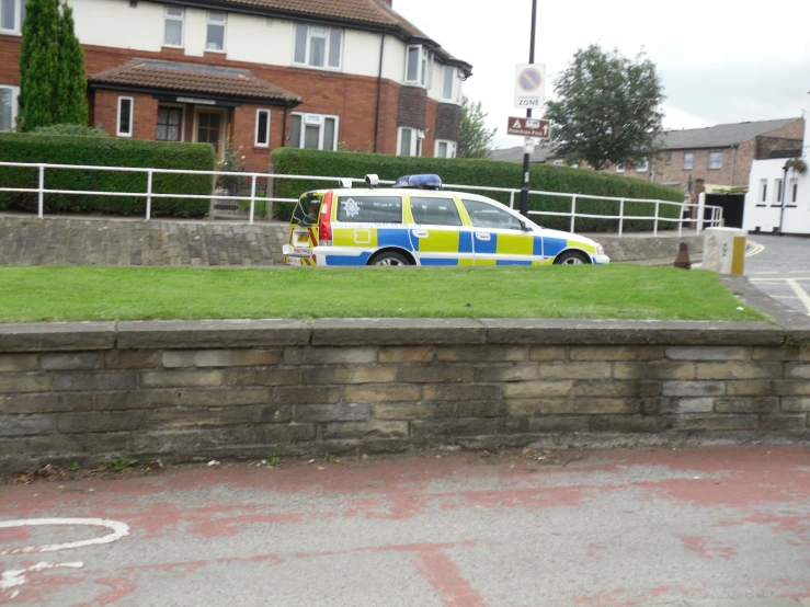 a police vehicle that is parked in the grass