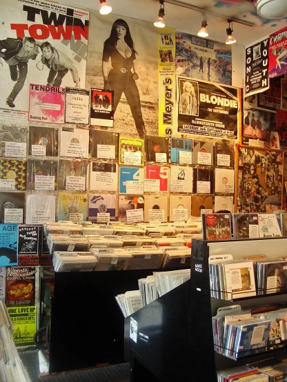 a display in a store filled with vinyl and records