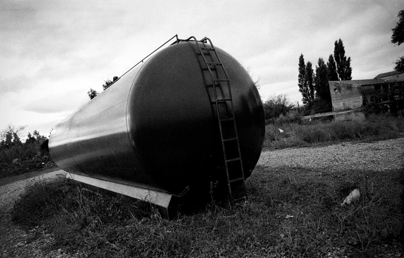 black and white po of a tank on the side of road