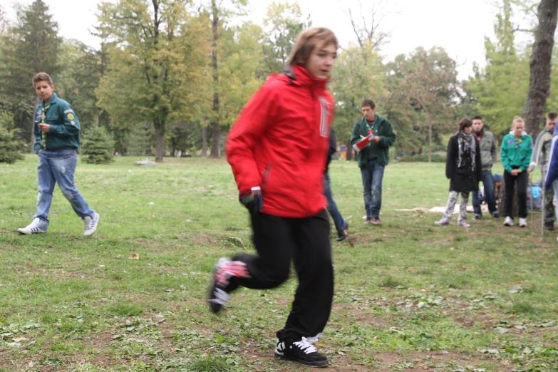 several people walking in a park during the day