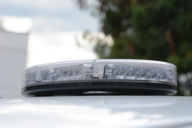 a close up of a police light on top of a police car