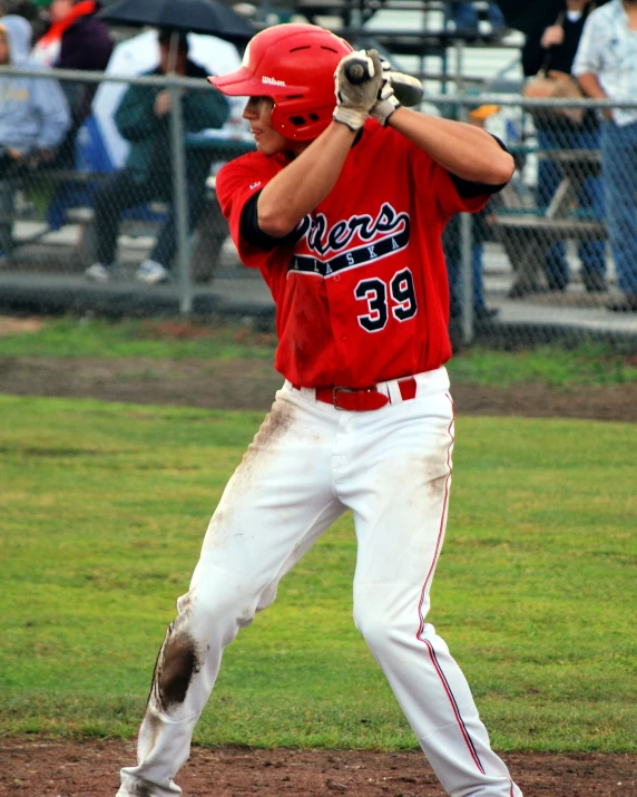 the baseball player is waiting for the pitch to be pitched