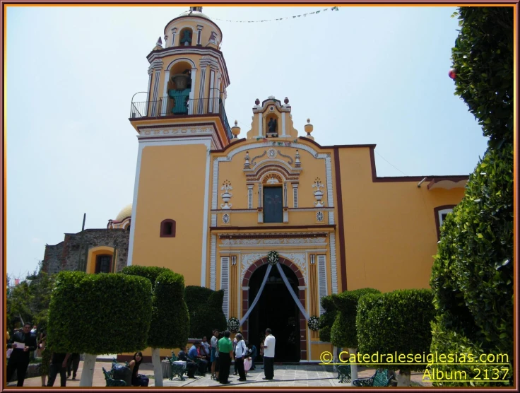 this church has a giant golden dome and large yellow building