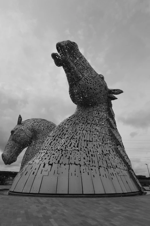 an abstract statue of a dog on a leash