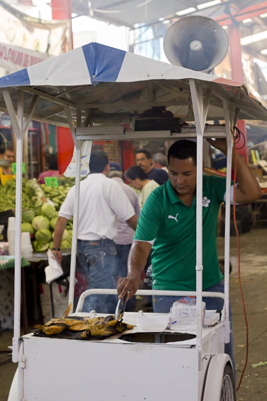 a man using a device to cook some food