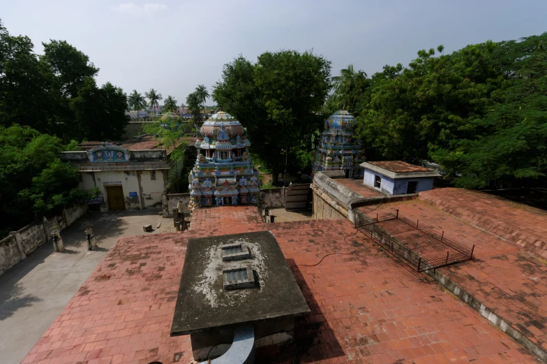 a bricked building with a statue on top