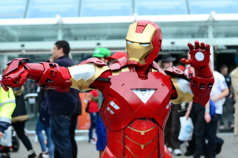 a person in an iron man costume at an event