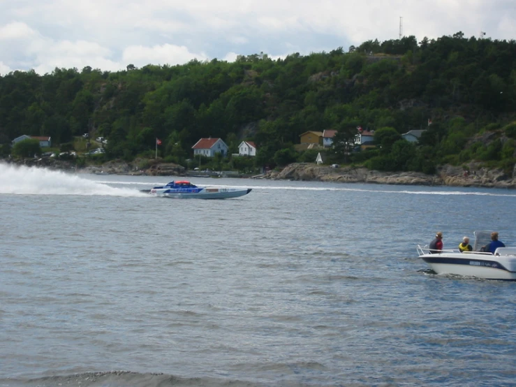 people on speed boats riding in the ocean