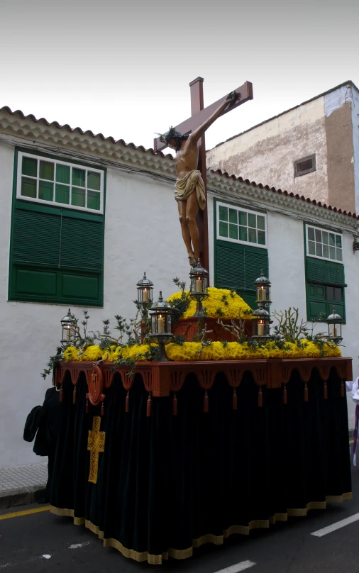 the statue on the cross is in front of the building