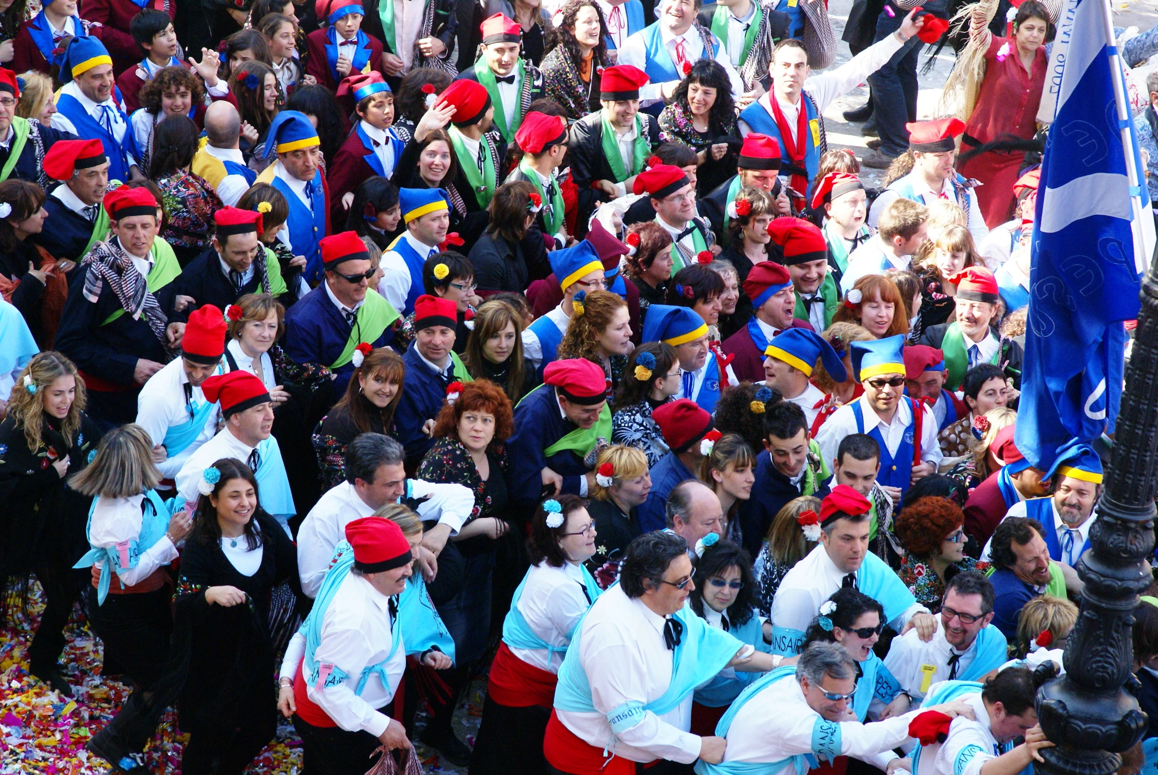 a group of people gathered together in colorful outfits