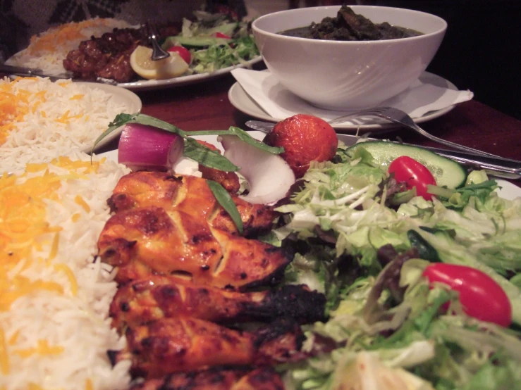 plated salads and plates with different types of meat