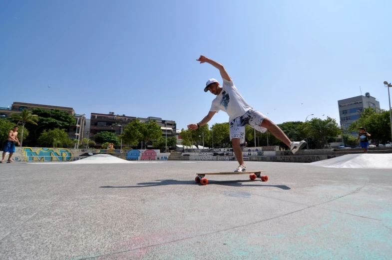 the skateboarder does a trick in the cement