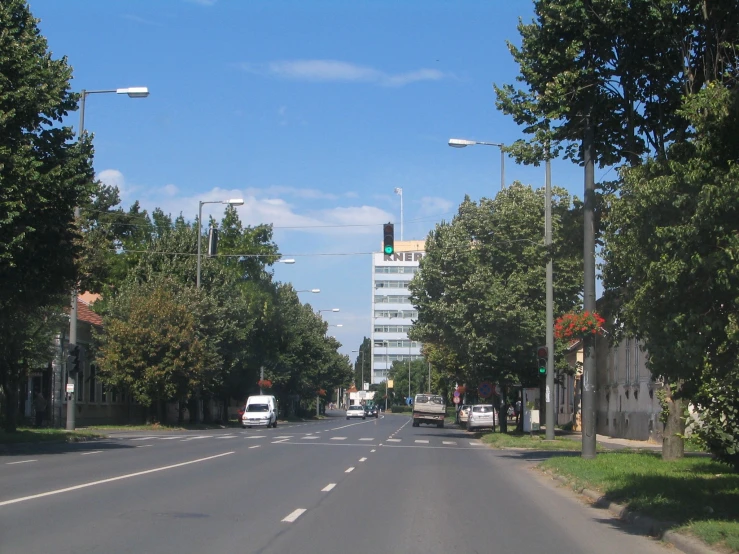 a car is sitting in front of a row of tall buildings