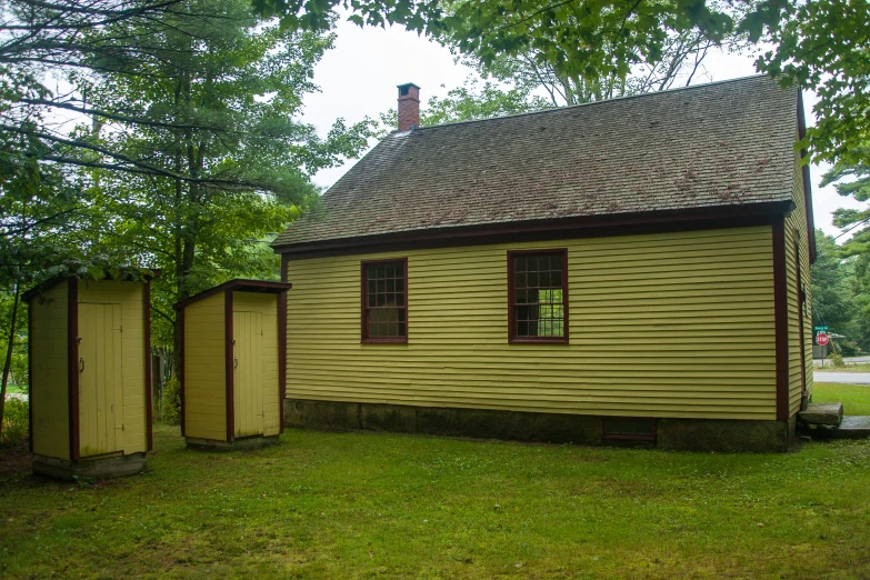 a small home is shown in the grass