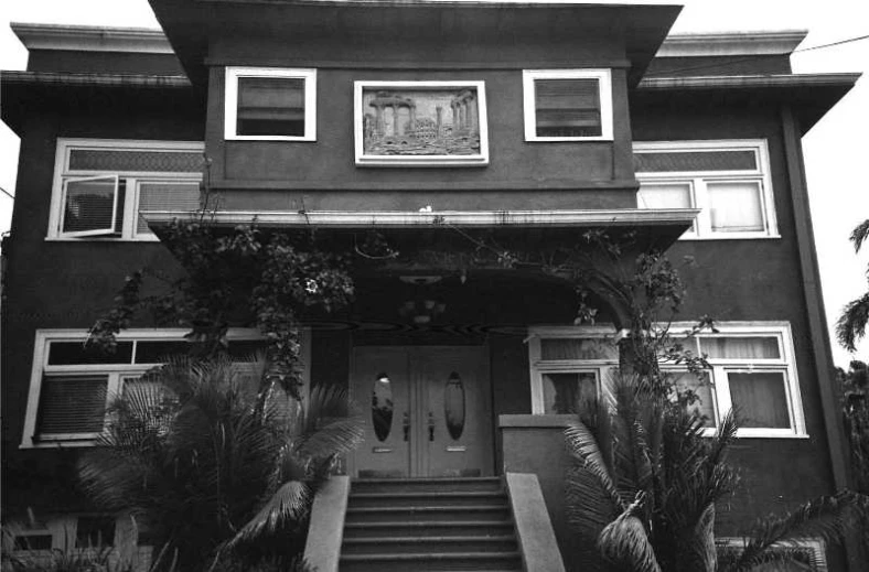 an old po of a house with stairs to the second floor