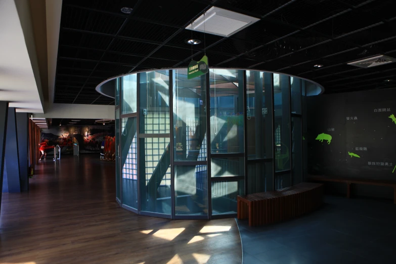 a large revolving glass container on the wall