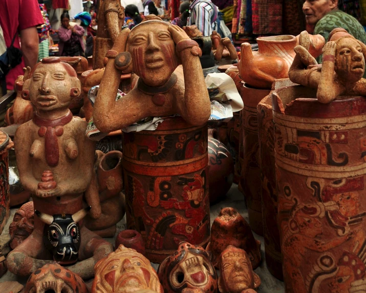 many vases in various shapes and colors on display