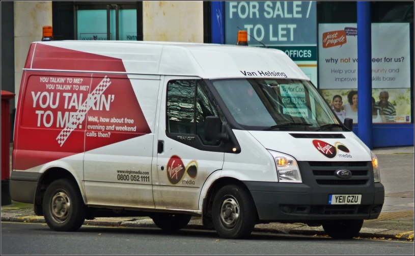 a delivery van is driving through a city