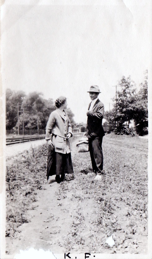 an old black and white po shows a couple holding hands