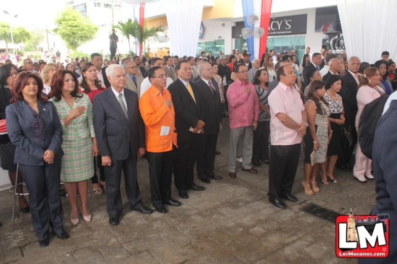 a group of people are watching some politicians