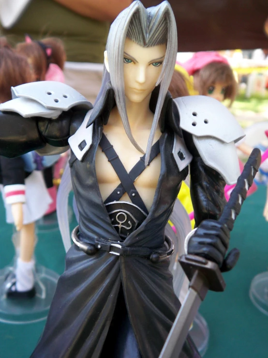 a figurine of a male character with two swords