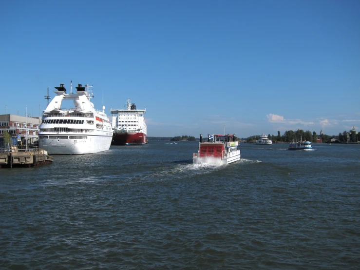 two ferries in the water at a dock